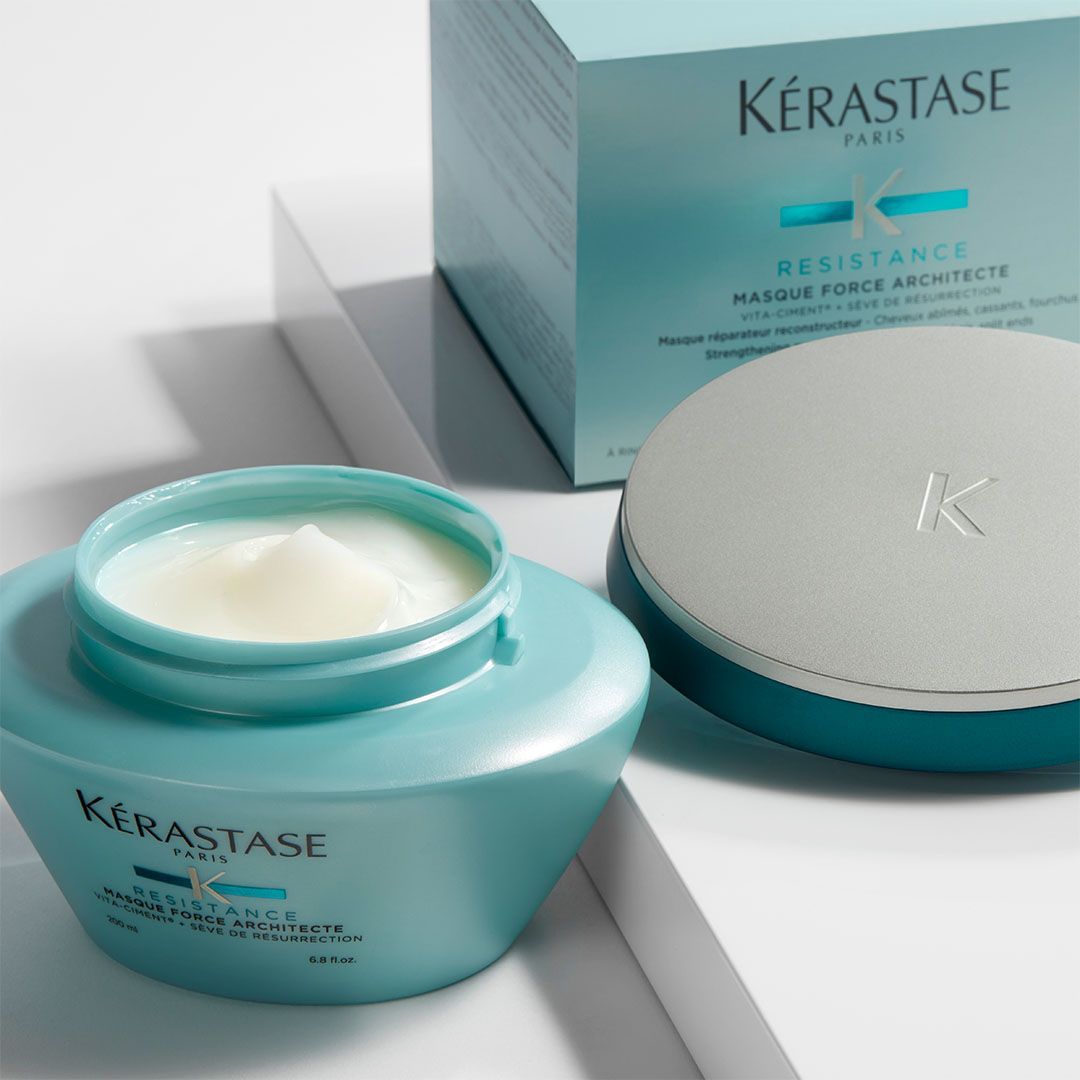 A jar of Kérastase resistance hair mask next to its box