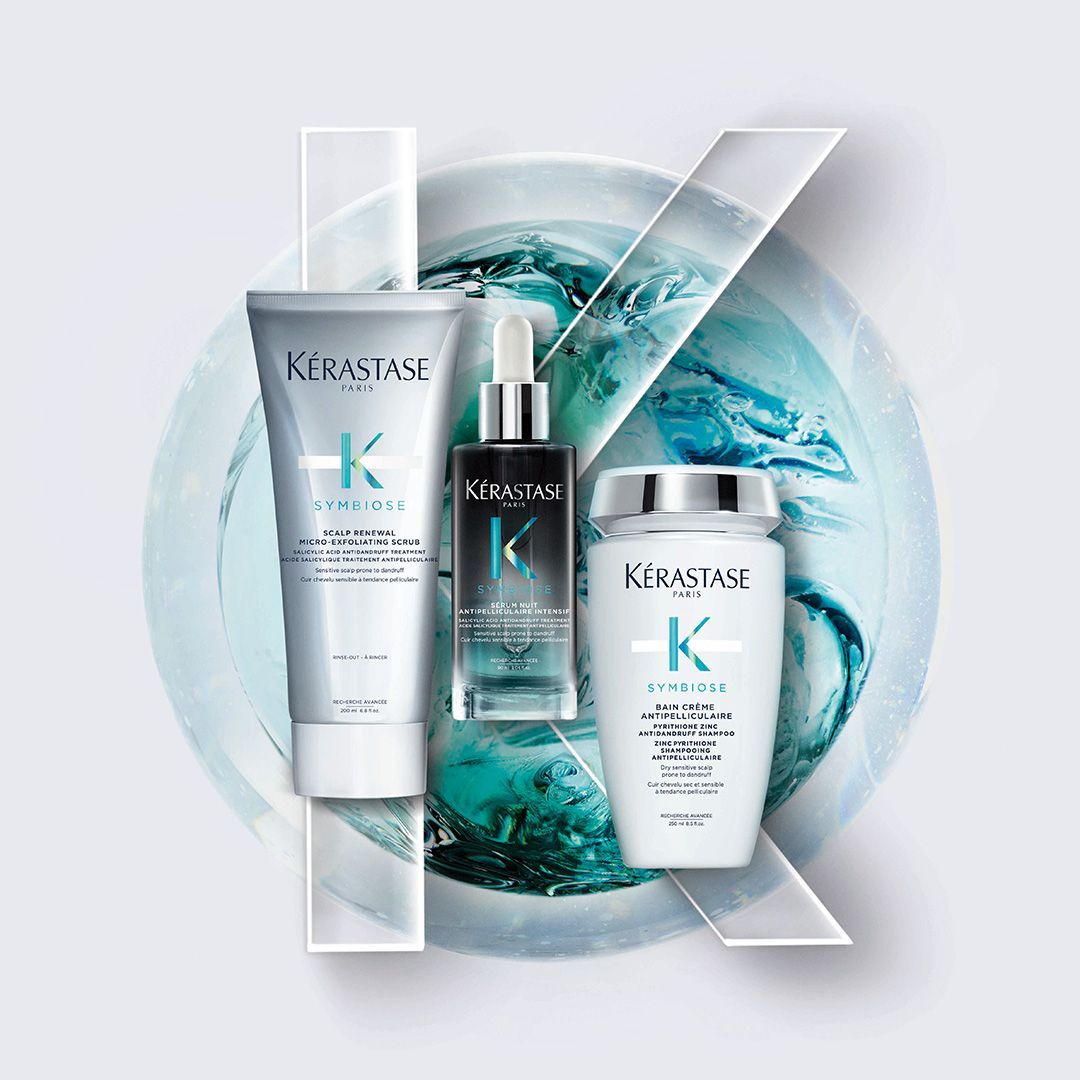 A group of hair products sitting on top of each other on a table