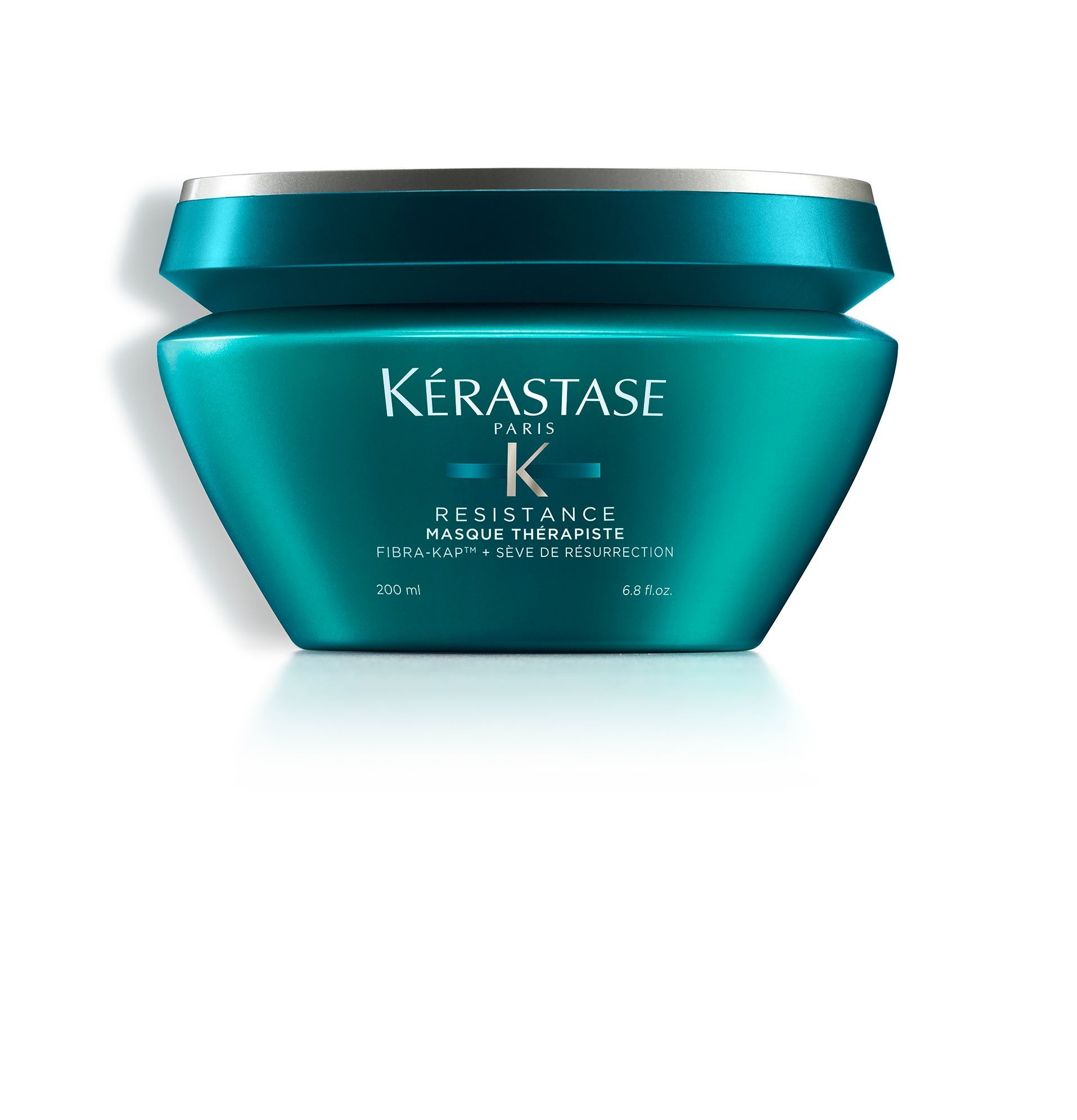 A jar of Kérastase hair product on a white background
