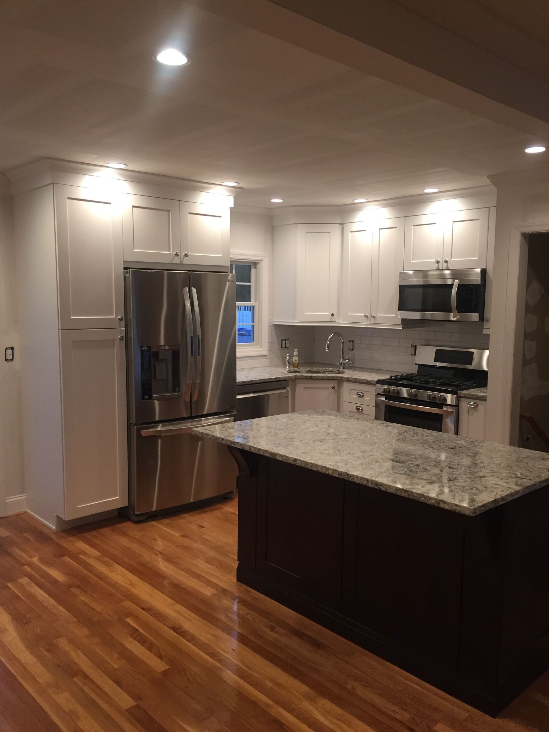 A kitchen with stainless steel appliances and granite counter tops