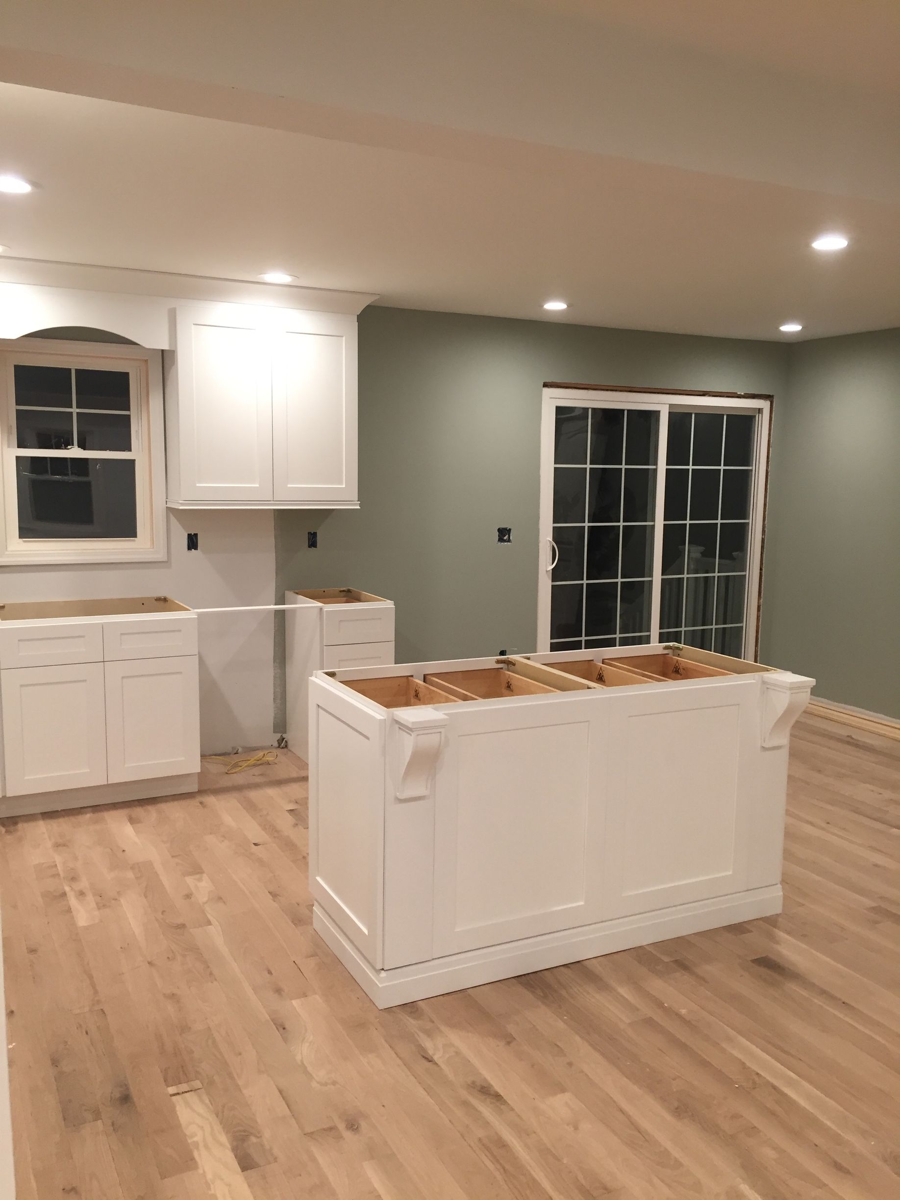 A kitchen with a large island in the middle of the room.