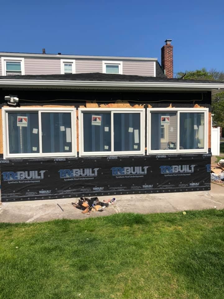 A house with a lot of windows is being built.