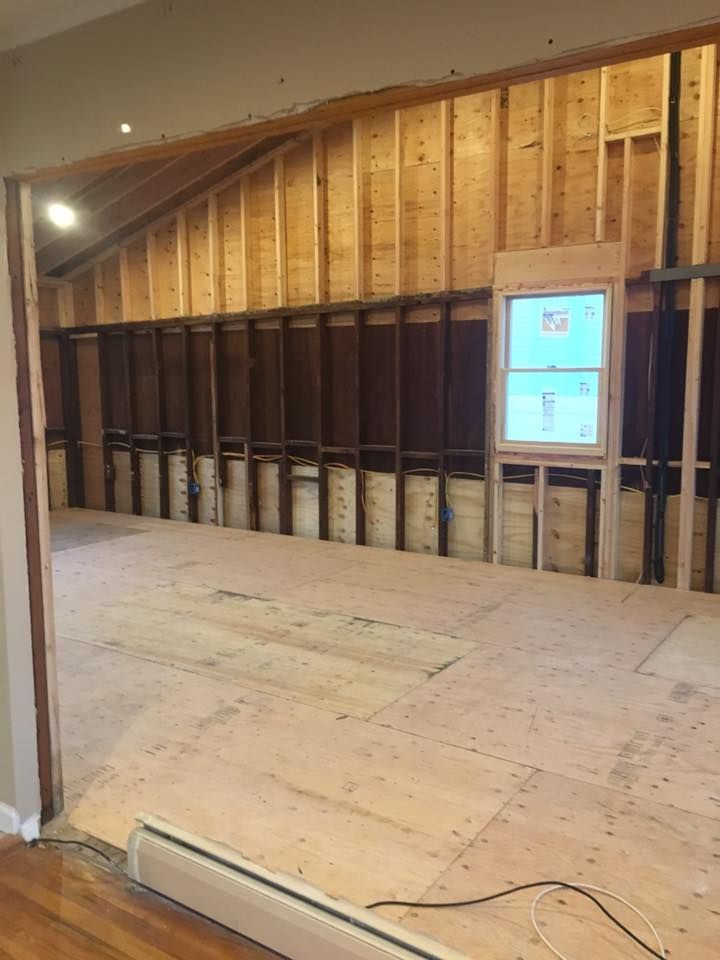 A room with wooden walls and a window in it.