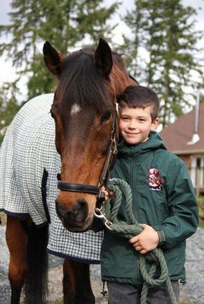 young boy with a horse