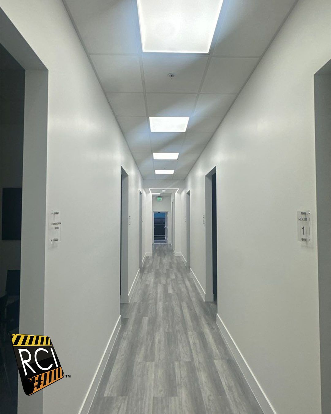 A long hallway with a sign that says rci on it