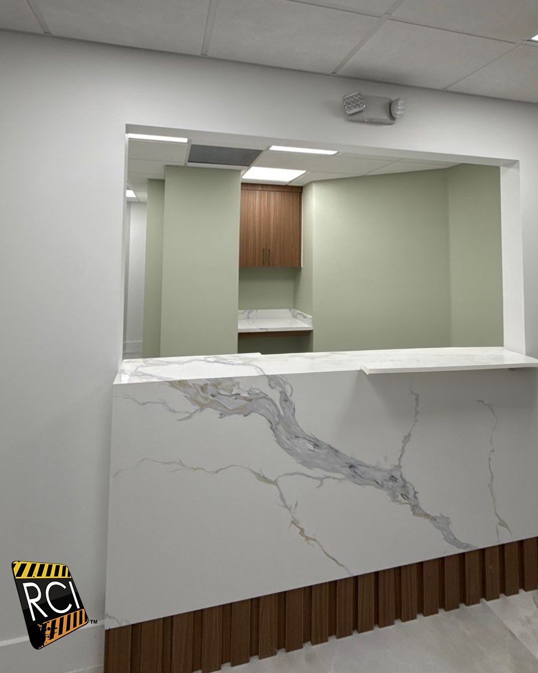 A white counter with a sign that says rci on it