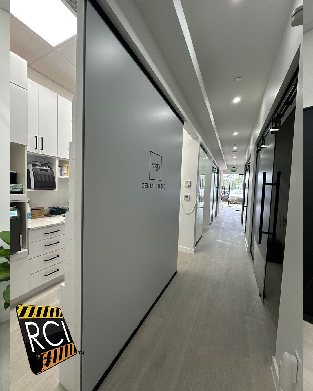 A long hallway with a sign that says rci on it