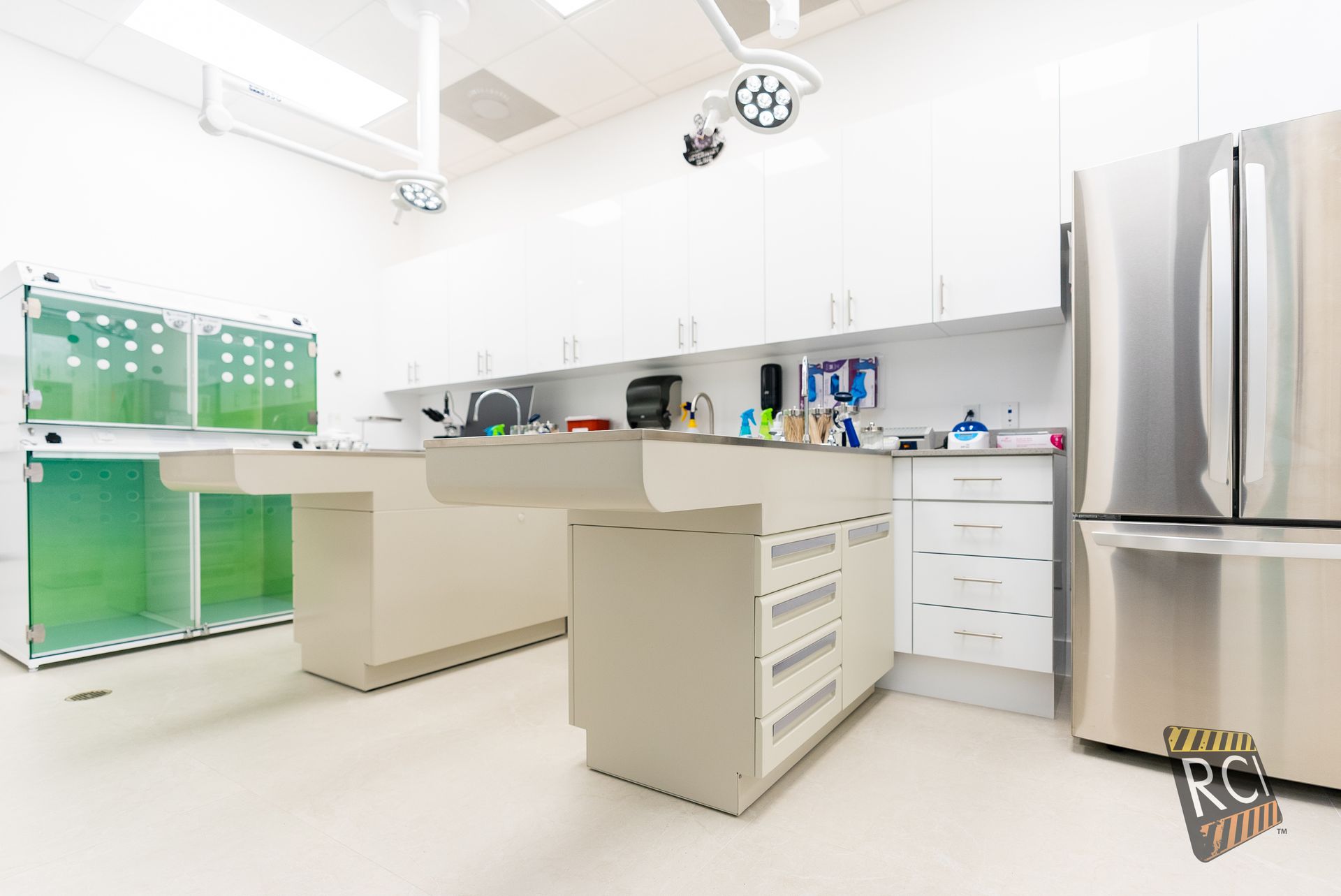 A kitchen with a refrigerator and a table in it