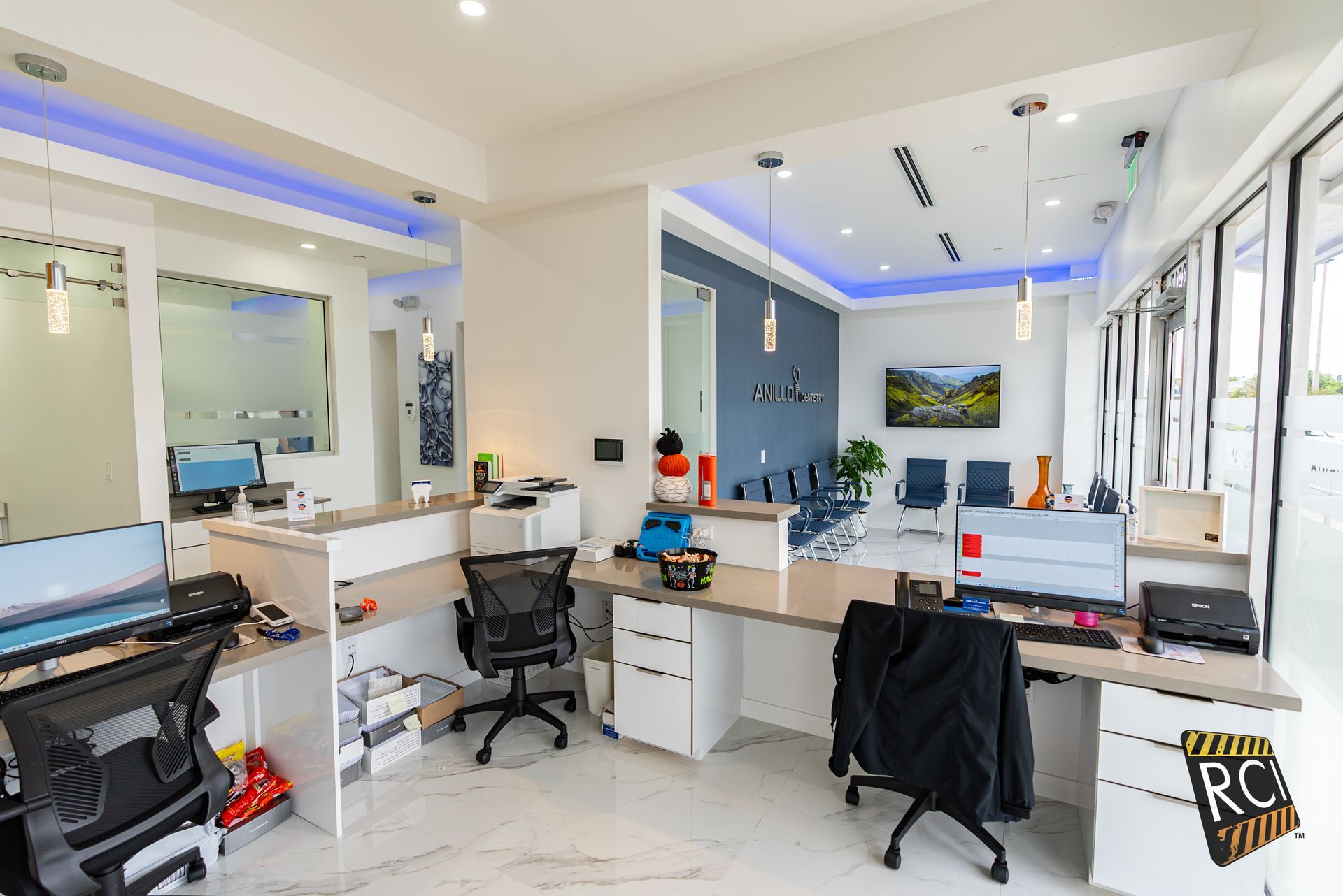 A room with a lot of desks and chairs in it.