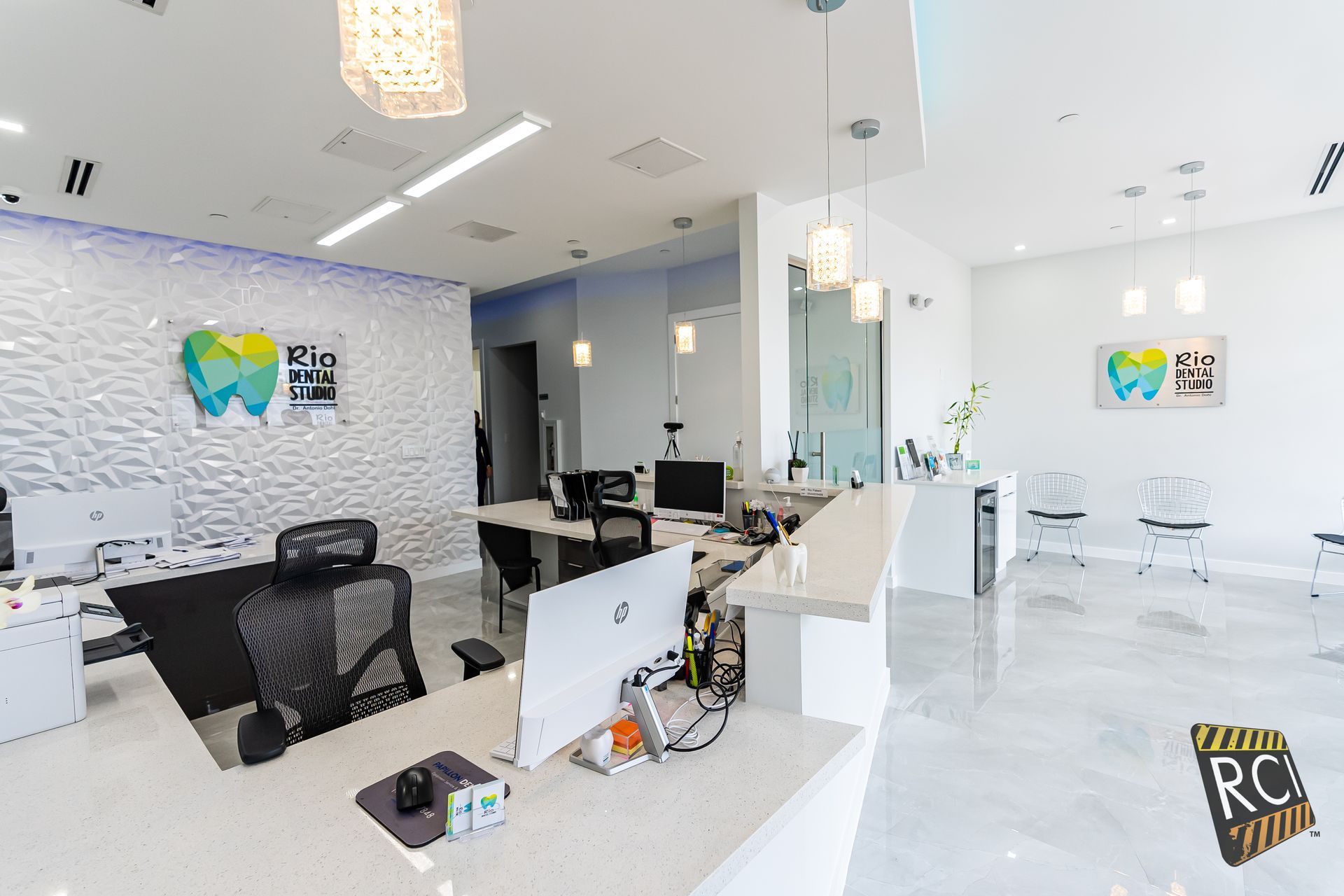 A dental office with a reception desk and a computer on it.
