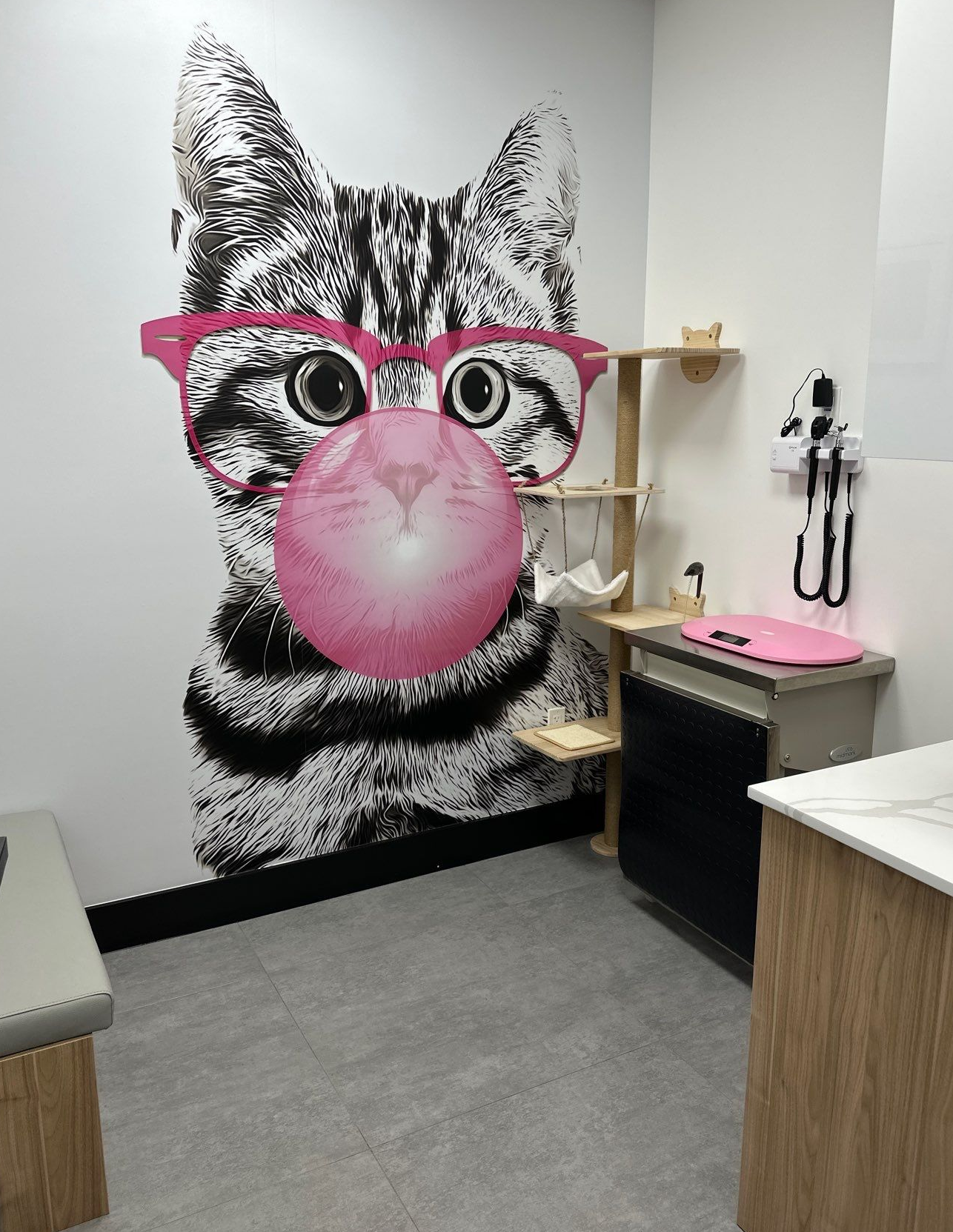 A brightly lit office hallway with a computer station