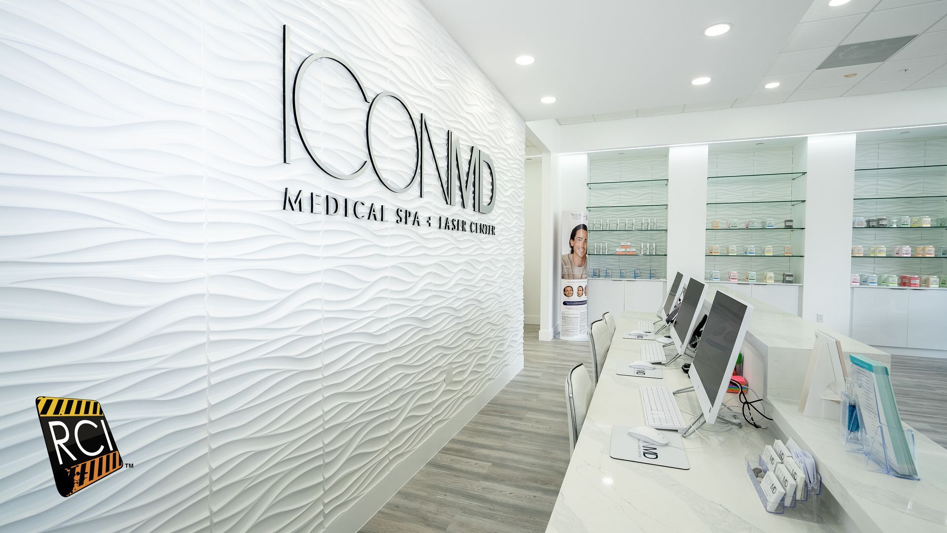 A white wall with the word icon on it