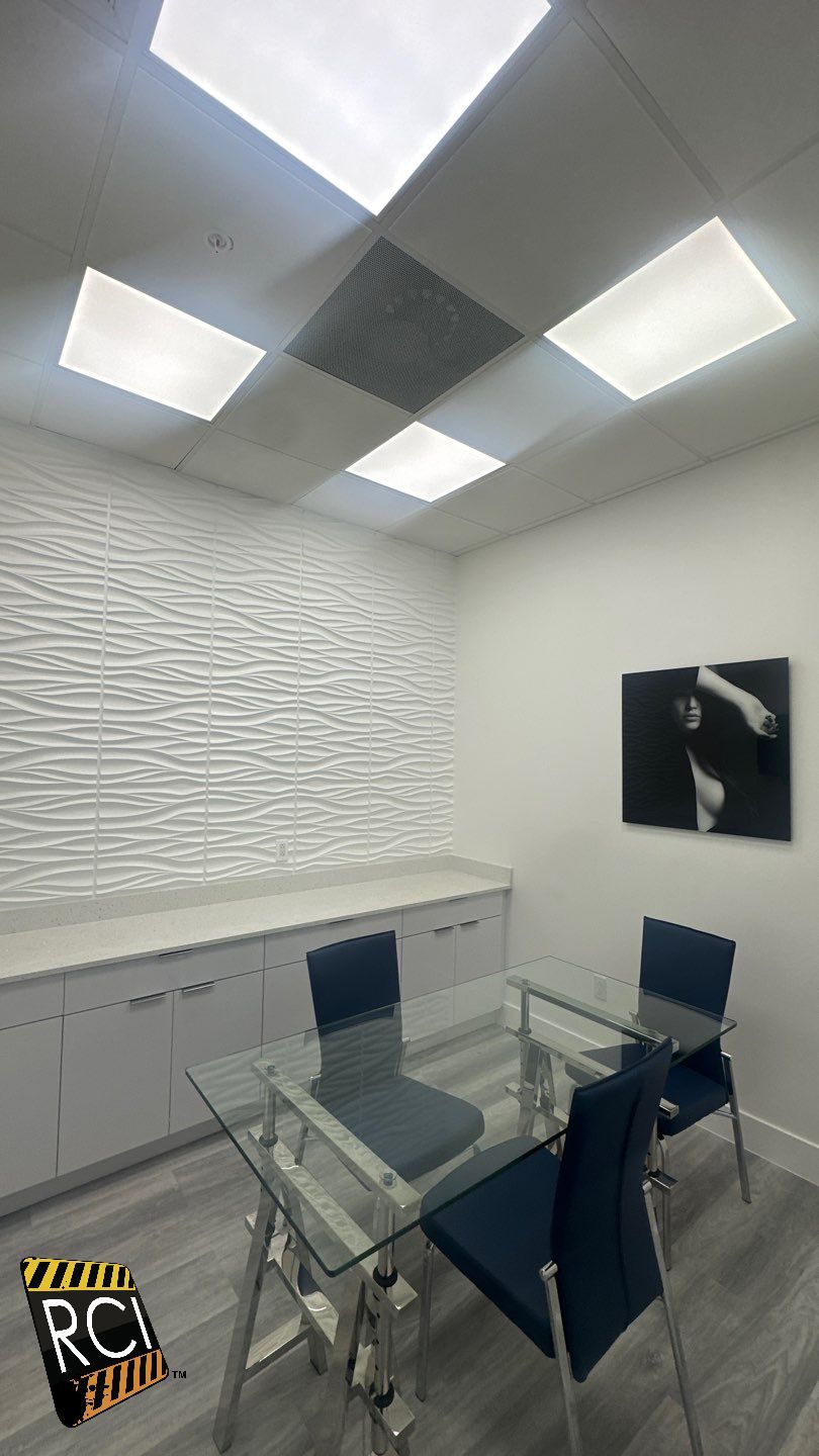 A conference room with a glass table and chairs.