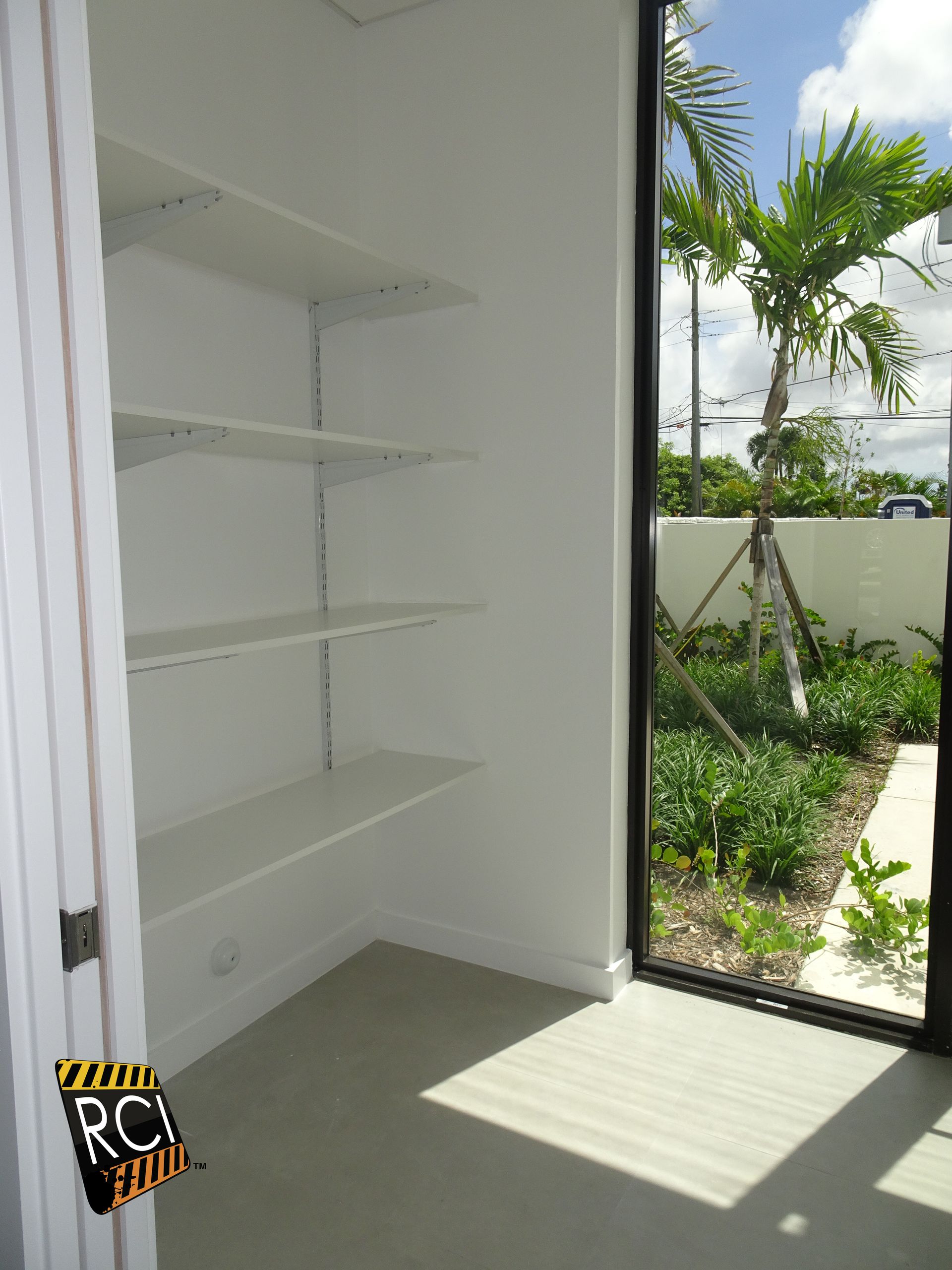 A room with shelves and a sign that says rc construction