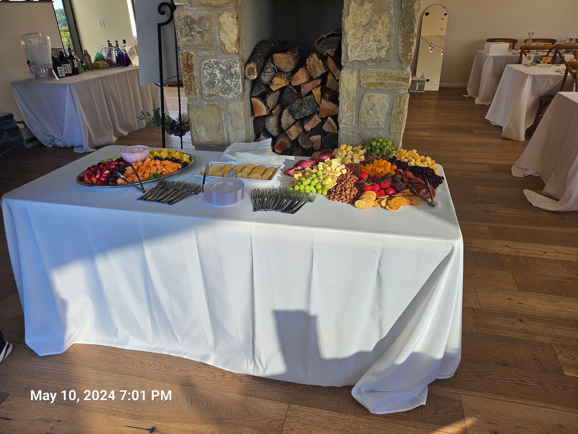 A table with fruits and vegetables on it is in a room