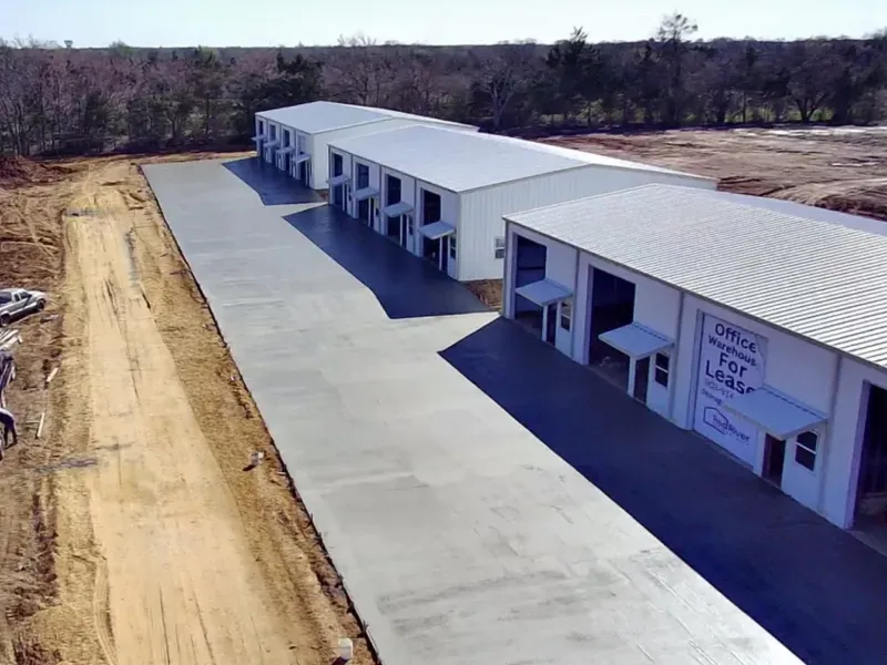 An aerial view of a building that says check for lease