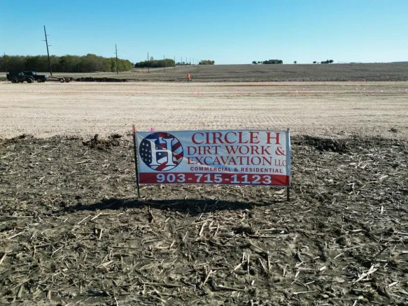 A sign for circle h dirt work and excavation