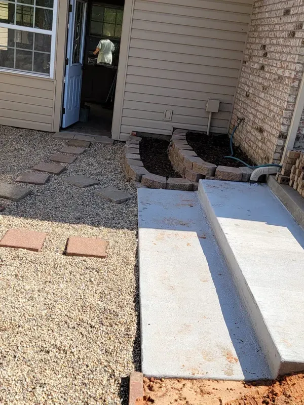 A brick house with steps leading up to it