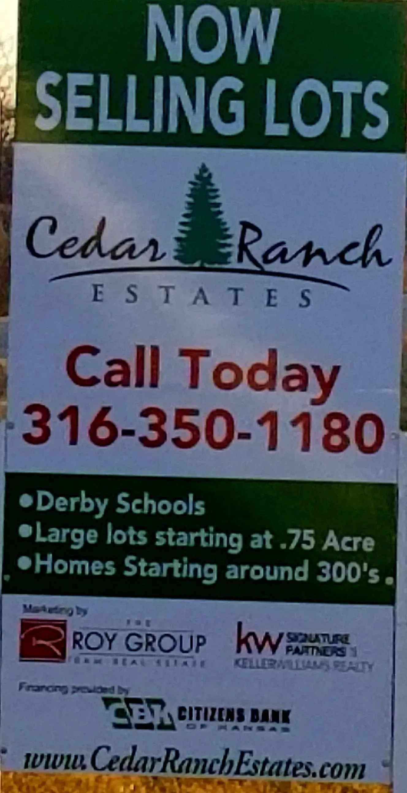 Cedar Ranch Estates real estate sign: “Now Selling Lots,” call 316-350-1180, 75-acre lots and homes starting under 300k.