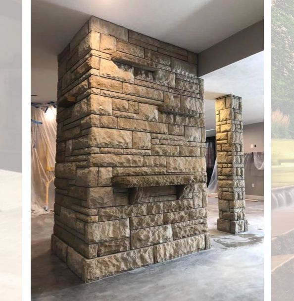 Stone pillars and wall in an interior setting. Light brown stone with recessed details.