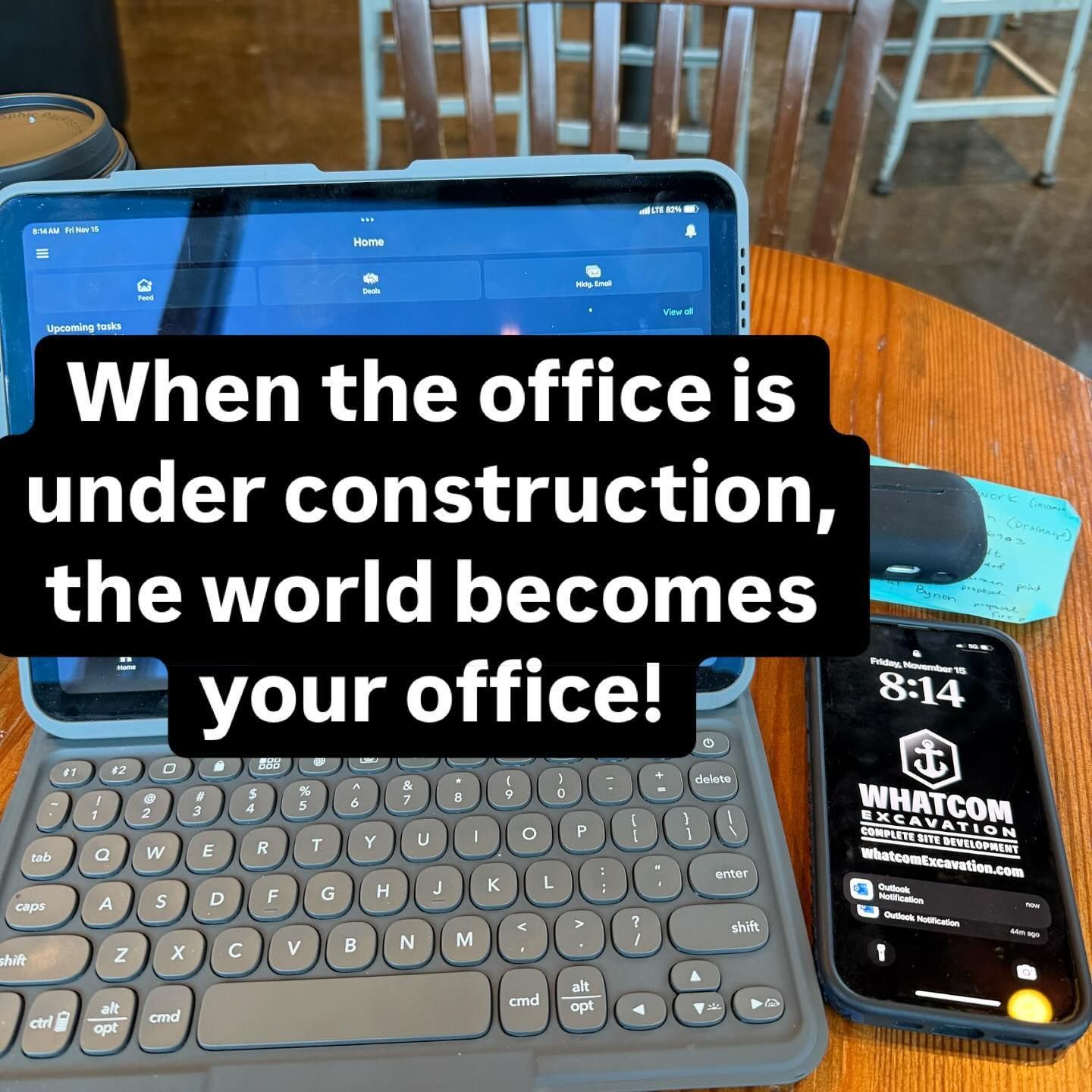 Tablet, keyboard, and phone on a table, with text: 