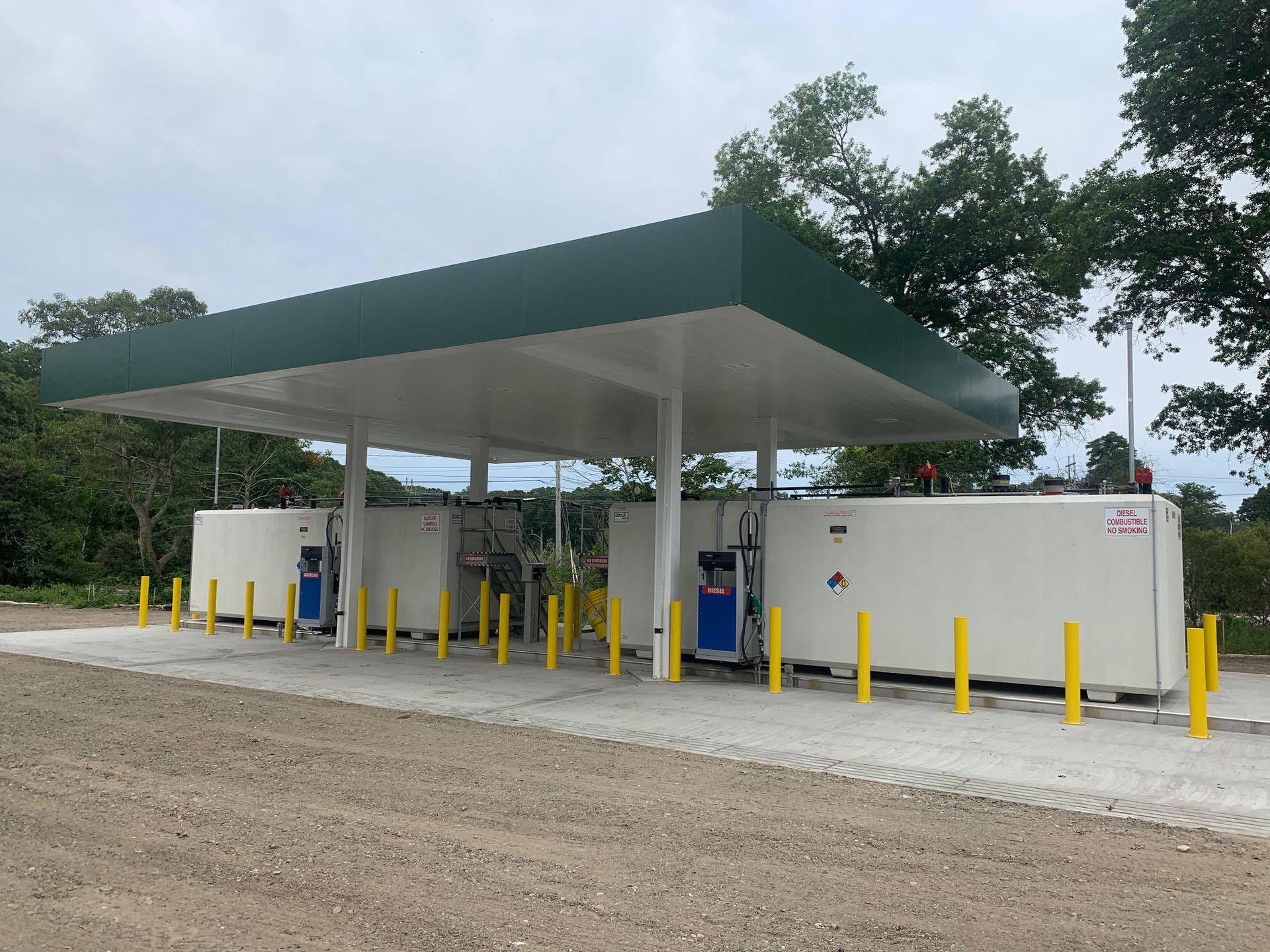 A gas station with a green roof