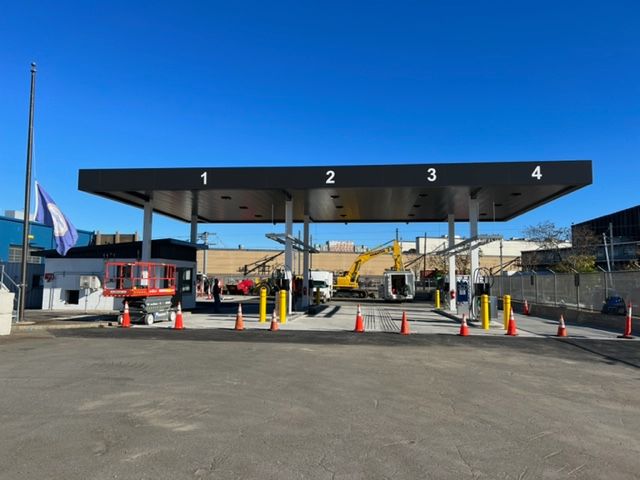 A gas station with construction equipment
