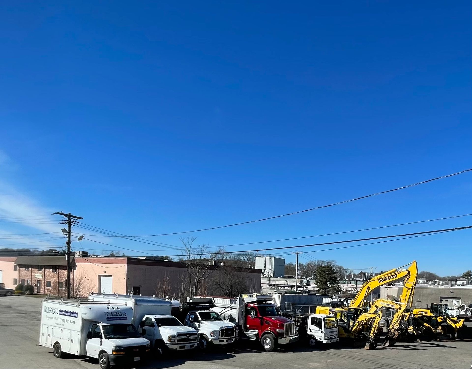 A group of trucks parked in a parking lot