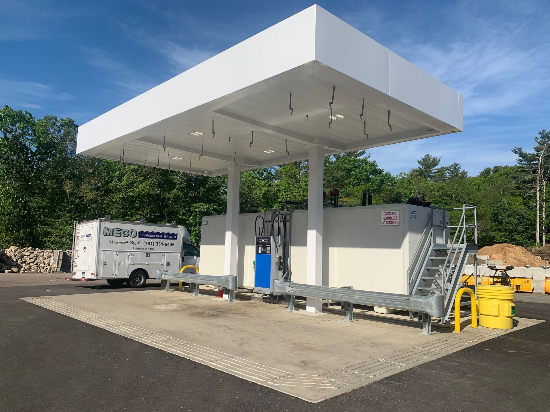 A white building with a large canopy