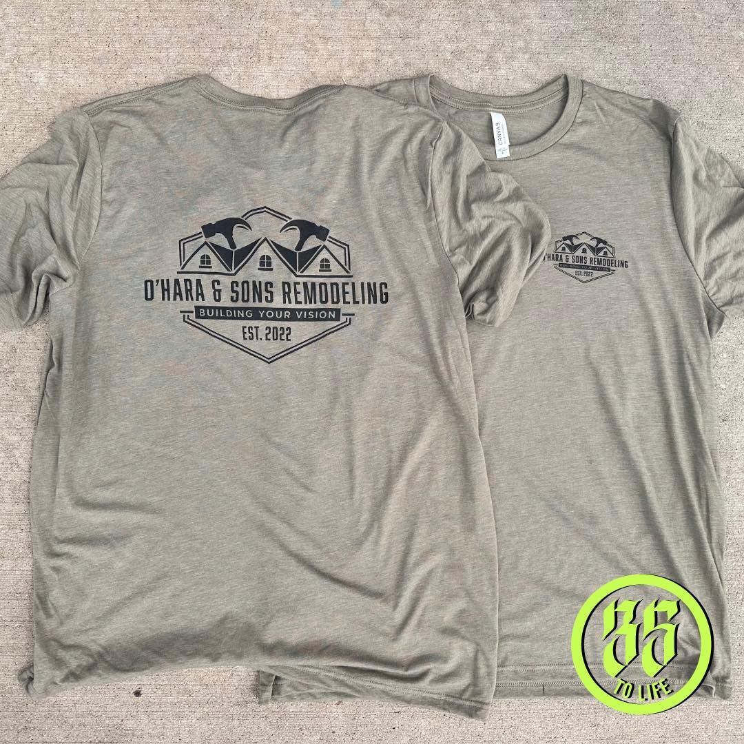 Front and back view of olive green t-shirt with black company logo for O'Hara & Sons Remodeling.