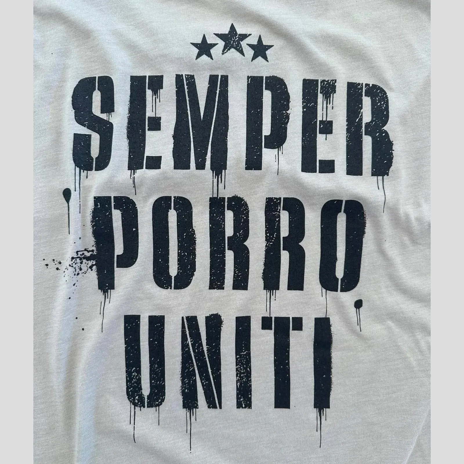 White shirt with black stenciled text: 