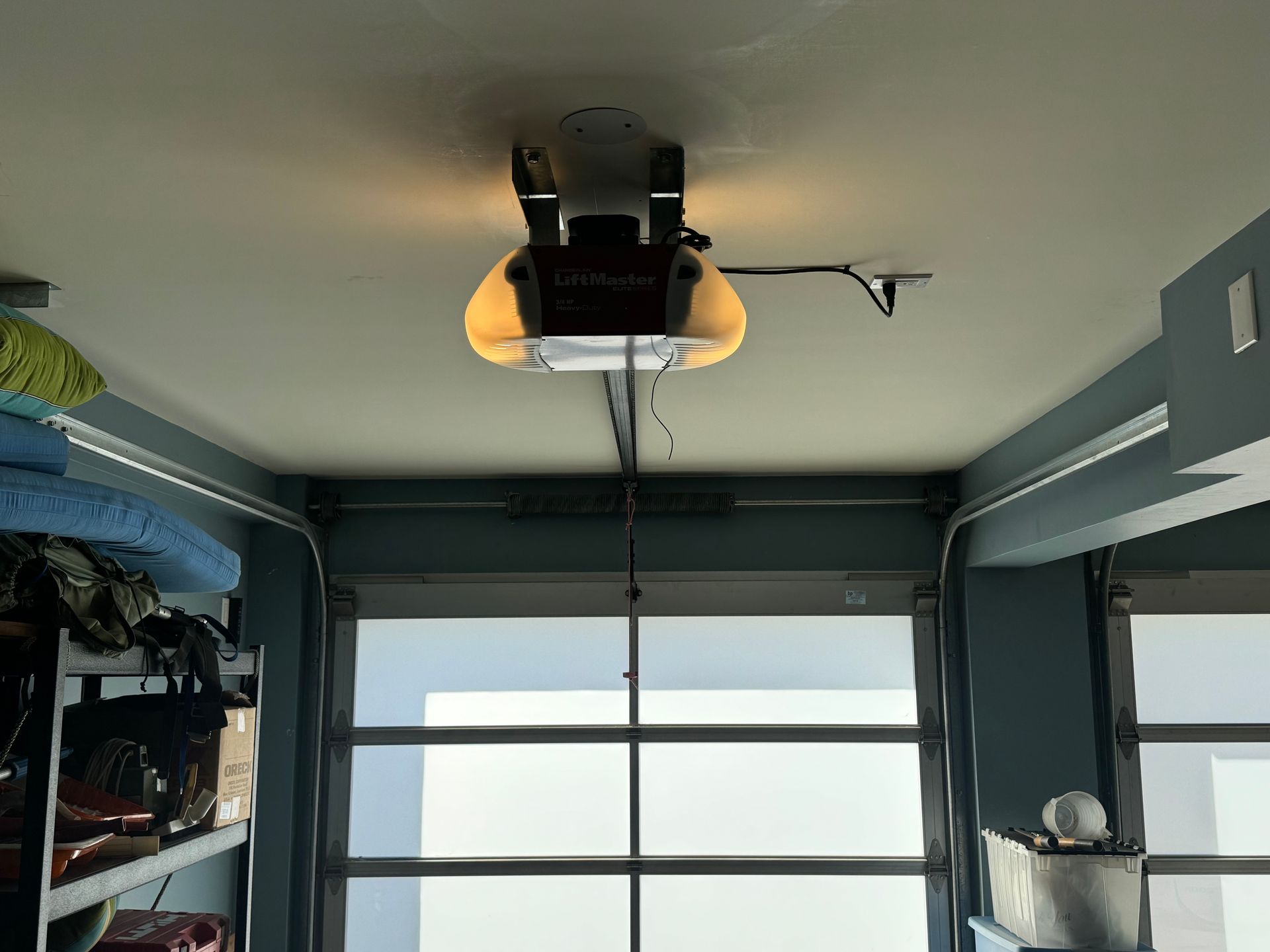 Garage interior with an overhead garage door opener.
