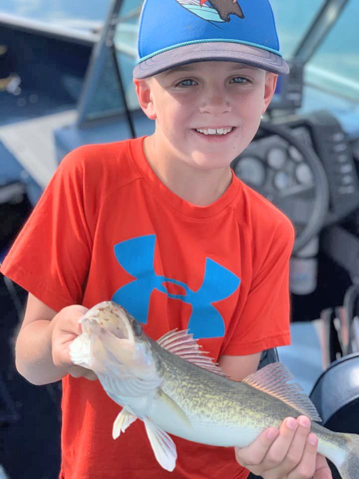 Boy holding a fish