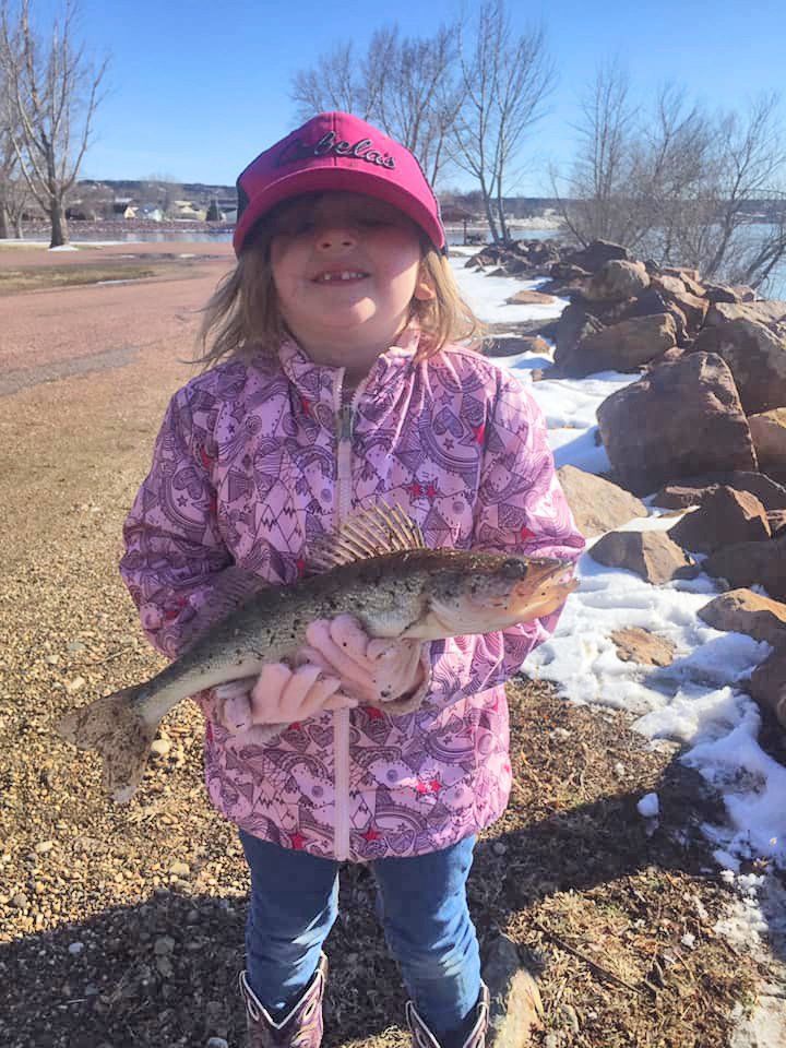 Girl holding a fish