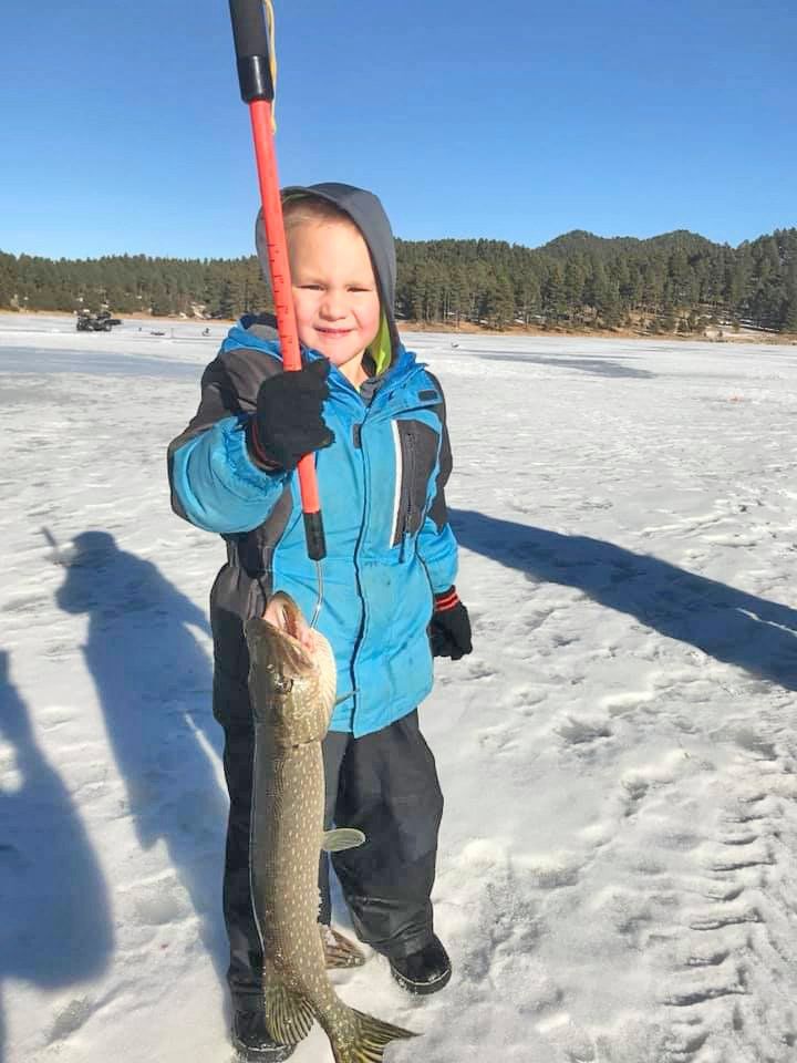 Boy holding a fish