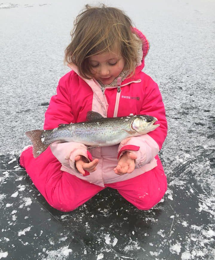Girl holding a fish