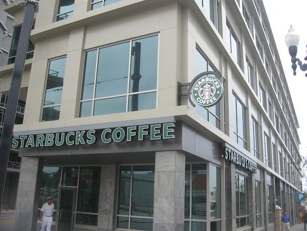 A large building with a sign that says starbucks coffee