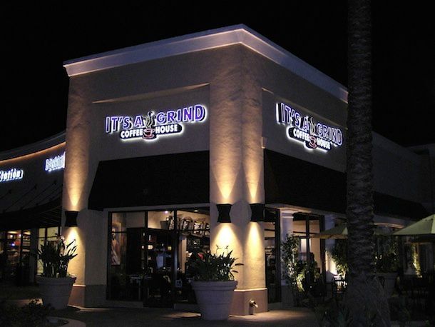 A restaurant called it 's a pound is lit up at night