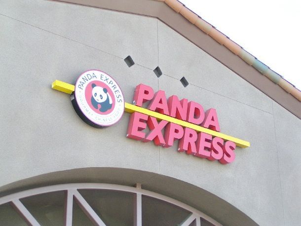 A panda express sign is on the side of a building