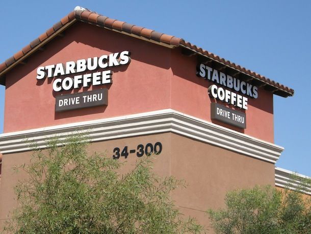 The outside of a starbucks coffee drive thru