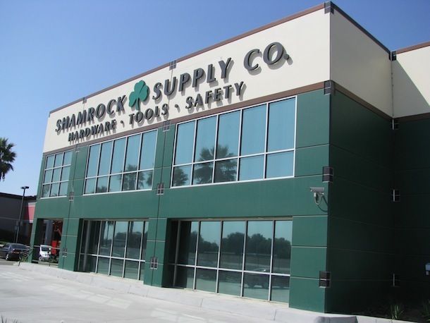 A shamrock supply co building with lots of windows