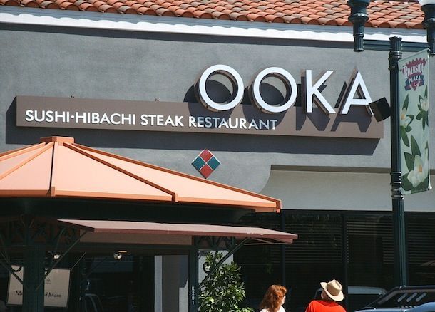 A sign for a sushi hibachi steak restaurant