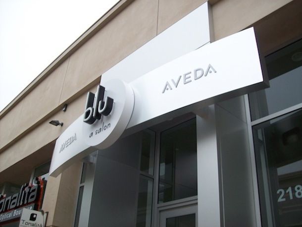 A store front with a sign that says aveda