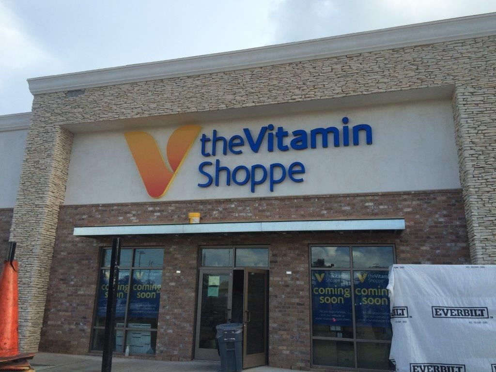The front of a vitamin shoppe store under construction