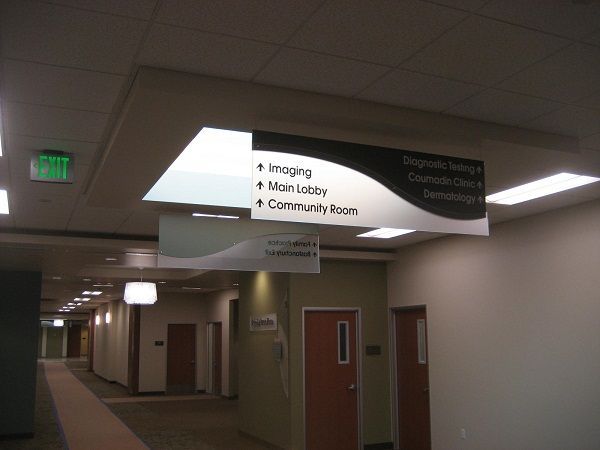 A hospital hallway with a sign that says imaging main lobby and community room