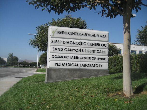 The newport hills animal hospital is lit up at night