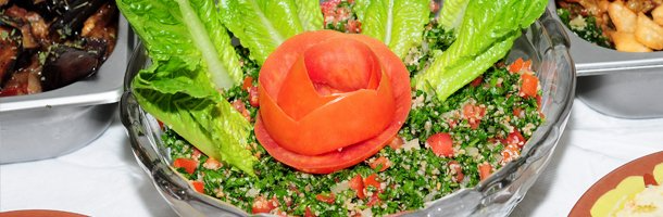 Vegetable salad with a rose styled tomato
