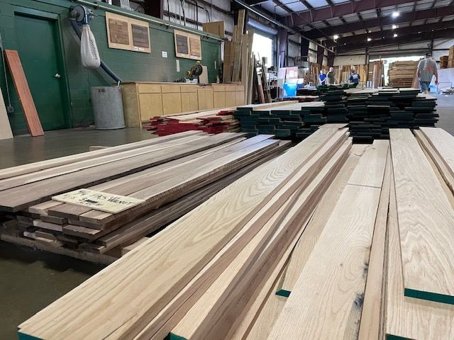 A warehouse filled with lots of wooden boards