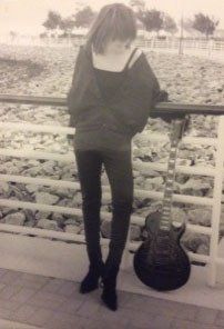 The wild child with her signature guitar