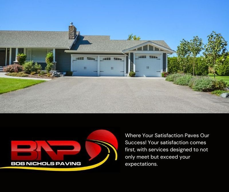 A residential driveway and house with a Bob Nichols Paving logo and slogan below on a black background.
